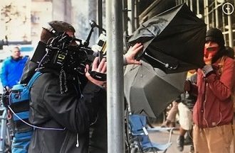 <strong>Migrant standoff in NYC turns ugly as 10 outside activists move against media with open umbrellas</strong>